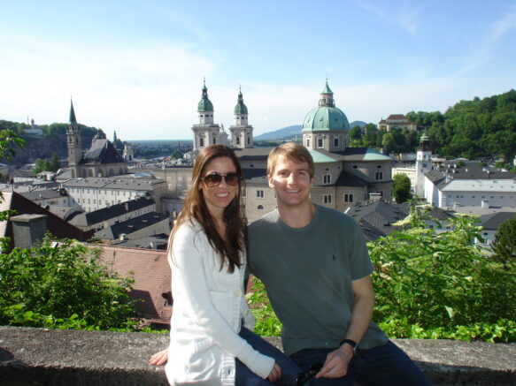 Woman in a white sweater sitting with a man in a green t shirt in Salzburg Austria