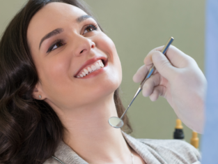 Middle age brunette woman smiling during periodontal health hygiene treatments